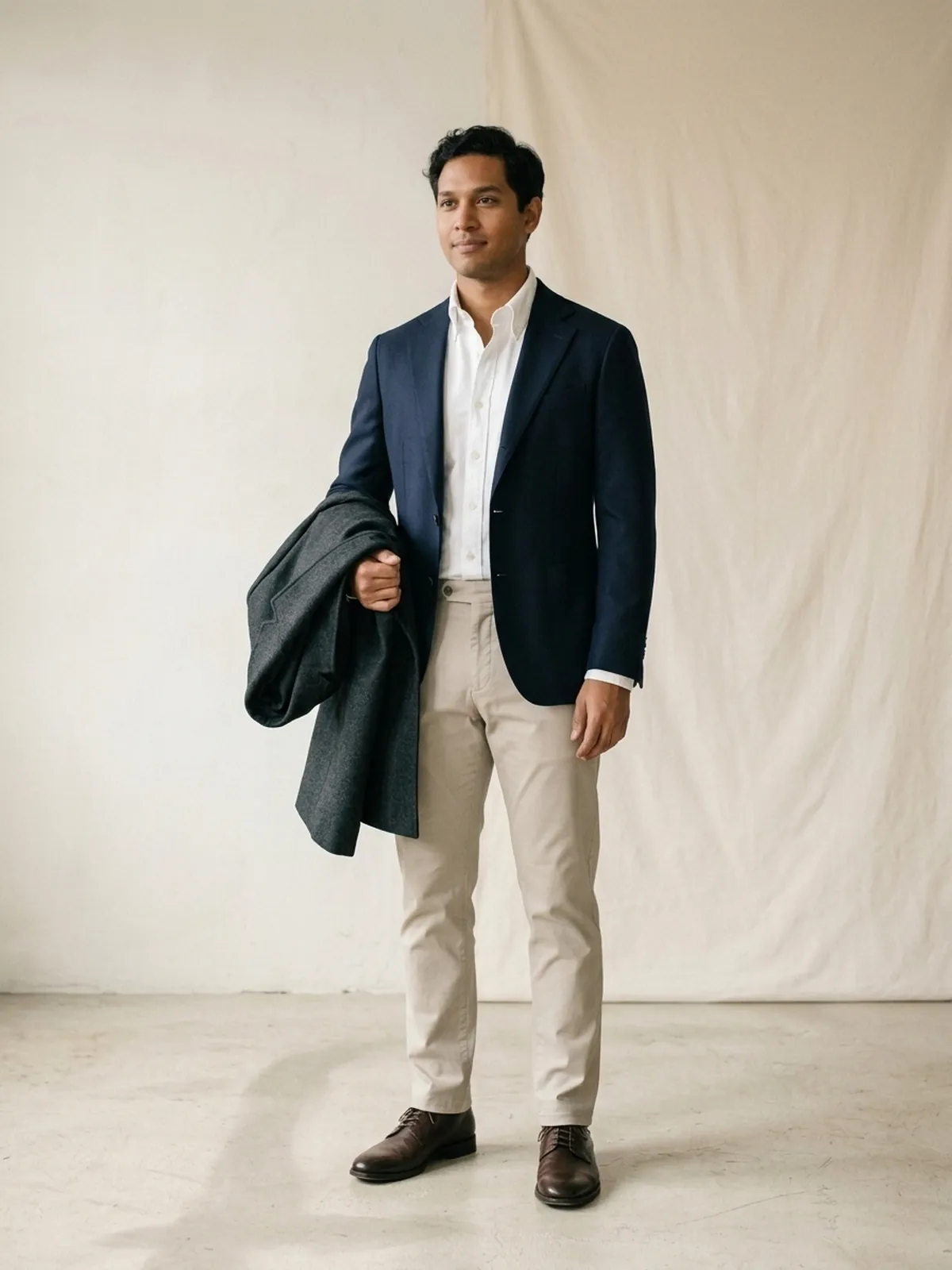 An avatar dressed for the office: white oxford shirt and navy blazer, the coat left off.